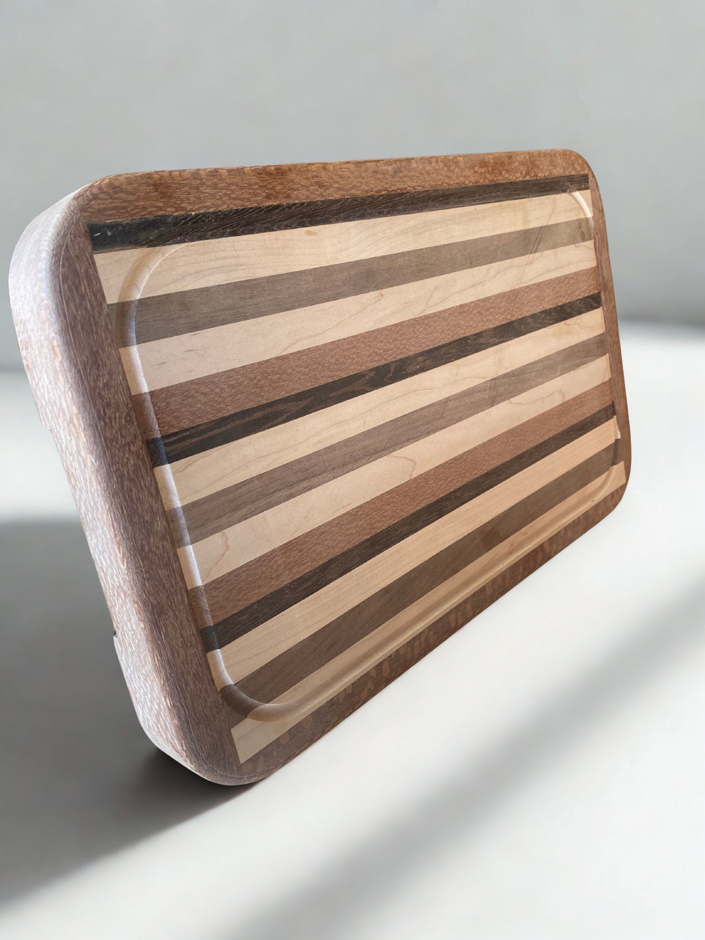 Exotic Hardwood Chef’s Cutting Board – Framed Drip-Edge Edition